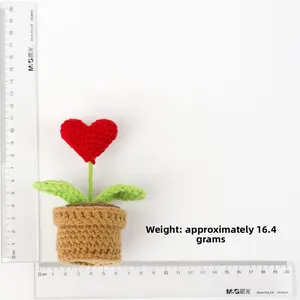 Detail showing hand-knitted heart plant height of 11.5cm with measurement scale