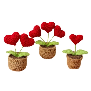 Handmade crochet heart potted plants in red and green for desktop decor and gifts