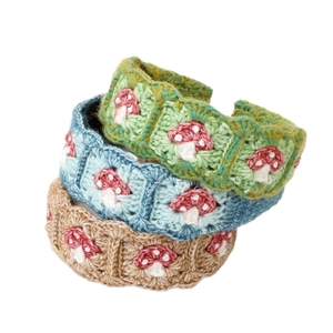 Handmade crochet hair clips with mushroom patterns in green, blue and brown tones