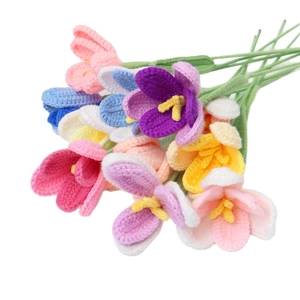 Handmade crochet gradient tulips in various colors including pink, blue, and yellow