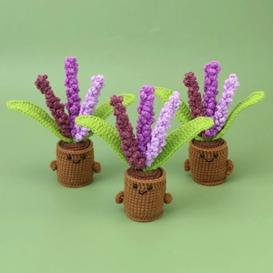 Detailed knit texture of handmade lavender potted plants with cute emoji faces
