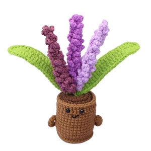 Handmade crochet lavender potted plant with cute smiling face and purple knit flowers