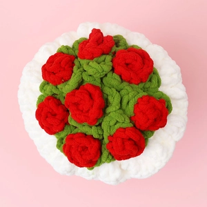 Macro view of hand-knitted red rose crochet bouquet with white ruffled decorative base