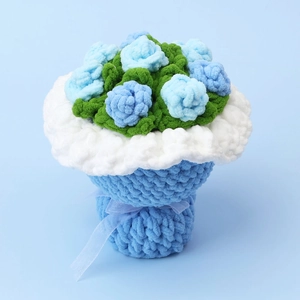 Detailed top view of handmade crochet sunflower bouquet with blue petals and velvet ribbon