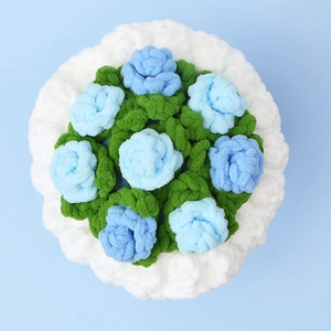 Detailed top view of handmade crochet sunflower bouquet in blue and green plush yarn