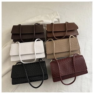 Flat lay display of woven leather shoulder bags in six various elegant colors