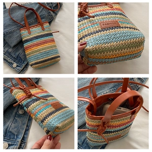 Detail of colorful striped straw woven crossbody bag with leather handles and interior space