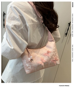Pink lace underarm bag featuring 3D butterfly embroidery and faux leather strap details