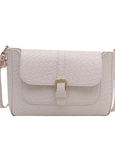 White vintage baguette bag with woven texture and gold metal buckle on white background