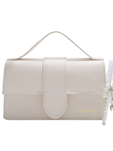 Elegant cream faux leather crossbody bag with fashion logo and pearl heart charm