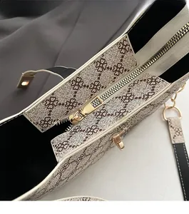 Detail of a smooth golden metal zipper on a vintage floral print shoulder bag