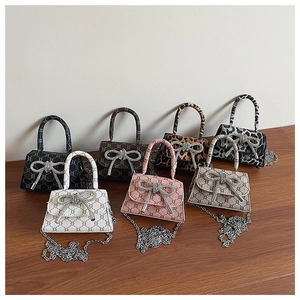 Collection of mini bow handbags in various patterns with silver rhinestone clasps