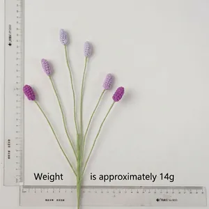 Close-up of hand-knitted lavender sprigs with six purple flower heads weighing 14 grams