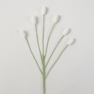 Detailed macro view of hand-knitted six-headed white bellflower with green cotton stems