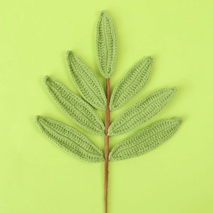 Handmade knitted green leaf bouquet with crochet texture for floral vase arrangements