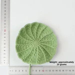 Detail shot of hand-knitted green lotus leaf crochet piece measuring 13.5cm in diameter