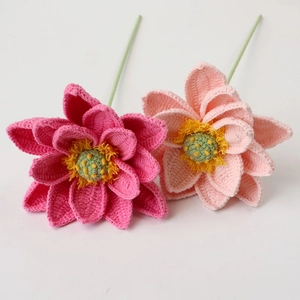 Detailed view of hand-crocheted lotus flowers with layered pink petals and textured yarn