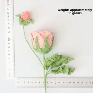 Detailed size view of a handmade crochet pink rose bouquet with ruler measurements