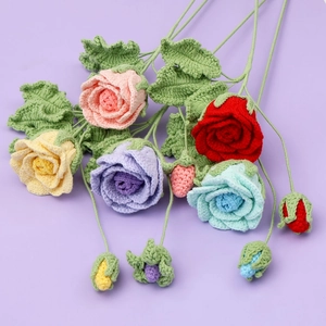Handmade crochet rose bouquet with five colorful flowers on a light purple background