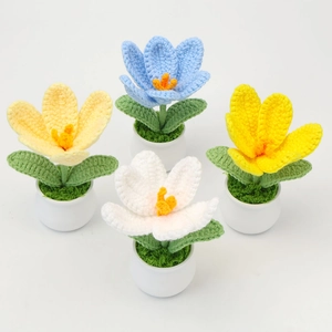 Set of four handmade crochet tulip potted plants in blue, yellow, and white colors