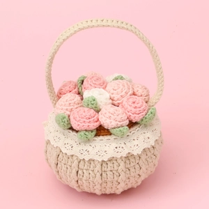 Handmade crochet flower basket with pink roses and white lace trim for home decor