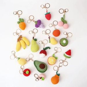 Handmade crochet fruit keychains collection featuring strawberry, avocado and orange