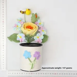 Handmade crochet yellow rose flower pot with bee and ruler showing dimensions