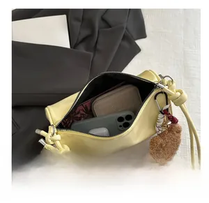 Top view of yellow faux leather shoulder bag interior showing large capacity for essentials