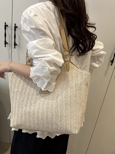 Large capacity woven straw tote bag with brown leather straps for beach and summer commute