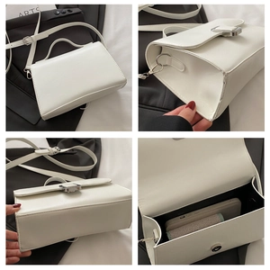 Détails du sac bandoulière en similicuir blanc montrant la boucle et l'espace intérieur