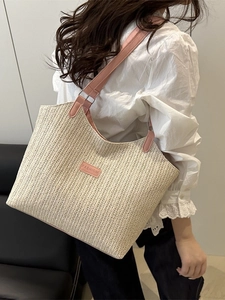 Handmade woven straw tote bag with pink leather straps and fashion label for beach summer beach