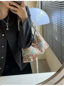 Ethnic style floral embroidery underarm bag with pleated design and knot shoulder strap