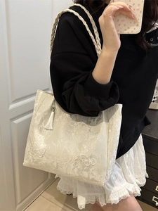 White canvas tote bag with butterfly embroidery and elegant tassel decoration
