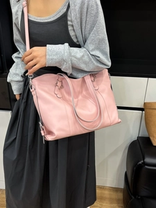 Pink large capacity faux leather tote bag with star hardware and adjustable strap