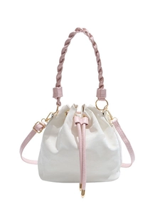 Minimalist white bucket bag with pink woven handle and drawstring for stylish daily wear