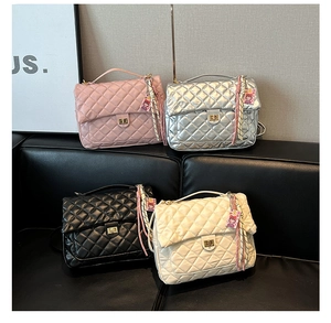Quilted tote bags in pink, silver, black, and white with golden twist locks and silk scarves