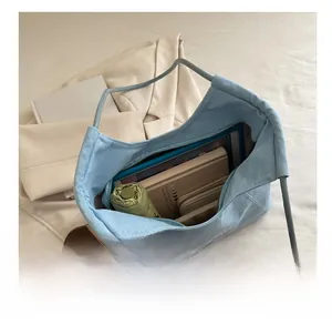 Internal view of the large capacity light blue denim tote bag with daily essentials