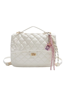 White quilted rhombic backpack with golden hardware and luxury hanging charms