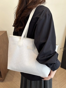 Minimalist white woven tote bag for women showing spacious capacity for daily commuting