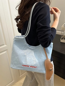Light blue denim tote bag with cute cartoon dog embroidery and large shoulder straps