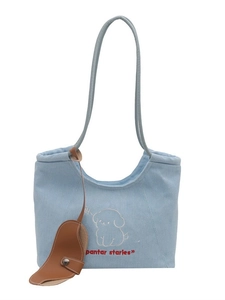 Blue denim tote bag with cute puppy embroidery and stylish brown leather charm