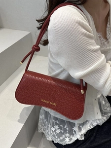 Retro red-brown faux crocodile skin underarm bag with knot strap and gold metal accents