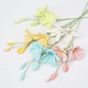 Macro shot of colorful handmade crochet dendrobium flowers with detailed cotton textures