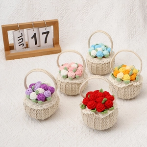 Detail of five assorted mini hand-crocheted flower baskets with colorful roses