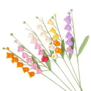 Handmade crochet lily of the valley bouquet in vibrant gradient colors and delicate cotton yarn