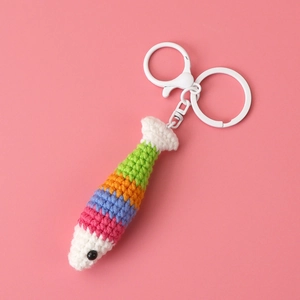 Handmade crochet colorful rainbow fish keychain with striped pattern and white metal clasp