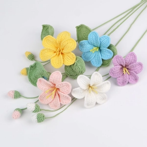 Vue détaillée de fleurs au crochet faites main avec texture de maille et couleurs vives
