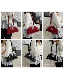 Detailed look at vintage glossy leather shoulder bags with lace bow and silver studs