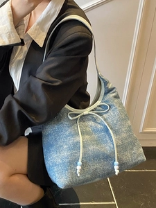 Light blue glitter denim tote bag with bow detail and beaded charm for women