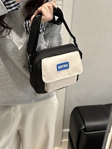 Minimalist black and white messenger bag with adjustable shoulder strap for daily wear